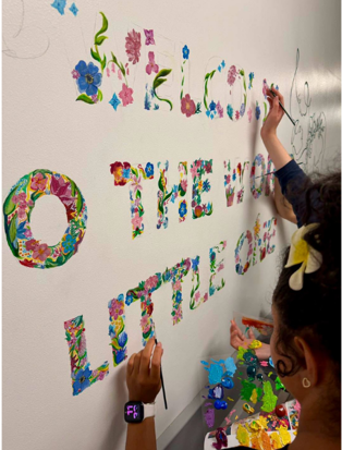 Mural being hand painted on maternity unit