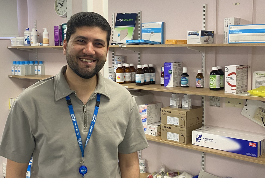 Pharmacist in front of medication