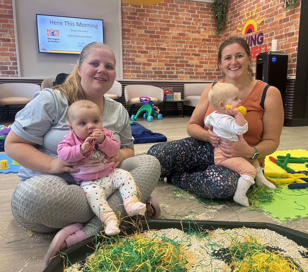 Photo of Charlotte Brooke, from Fairfield, with six-month-old Mya-Mae Green, and Carly Hennessey from Stockton Heath, with 13-month-old Georgia, who attend the hub’s stay and play sessions